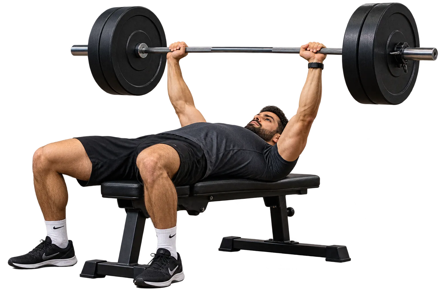 Athlete lying on a flat bench, holding a loaded barbell at arm’s length above the chest